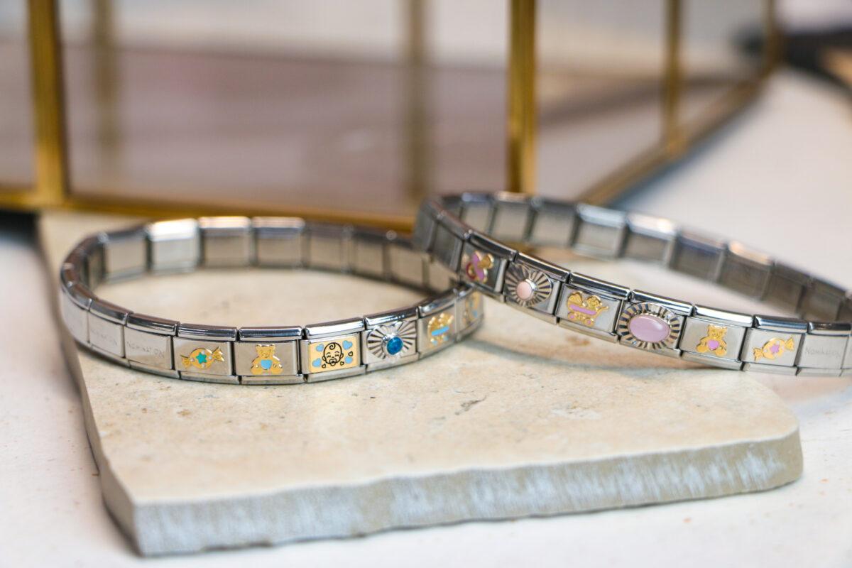 Image shows two Nomination bracelets adorned with a variety of Nomination charms.